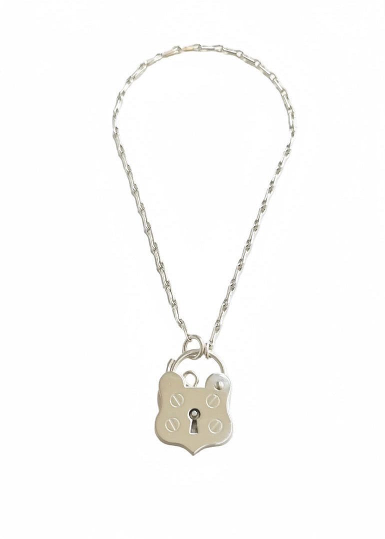 Sterling silver bracelet with a shield shaped padlock made by Bird