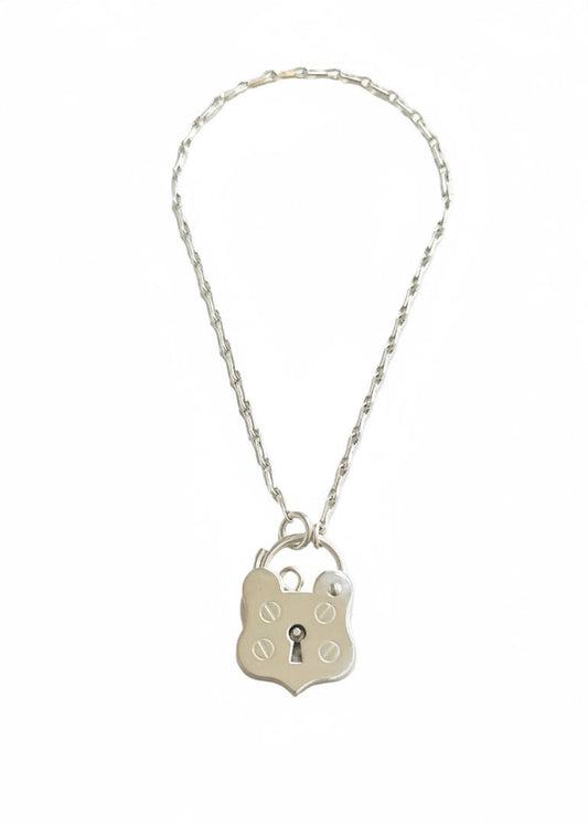 Sterling silver bracelet with a shield shaped padlock made by Bird